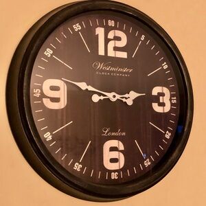 Black Wall Clock with dark brown face 18 inches across